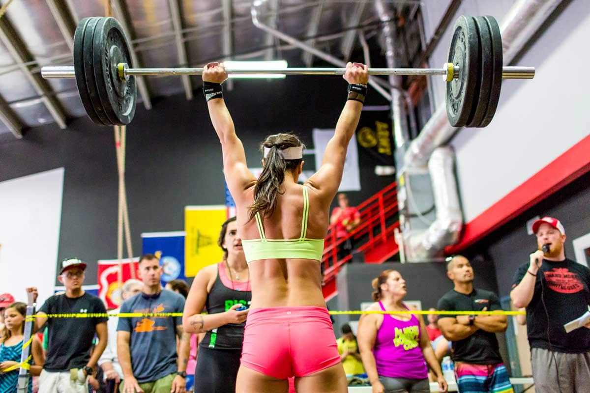 crossfit athlete performing-overhead barbell movement