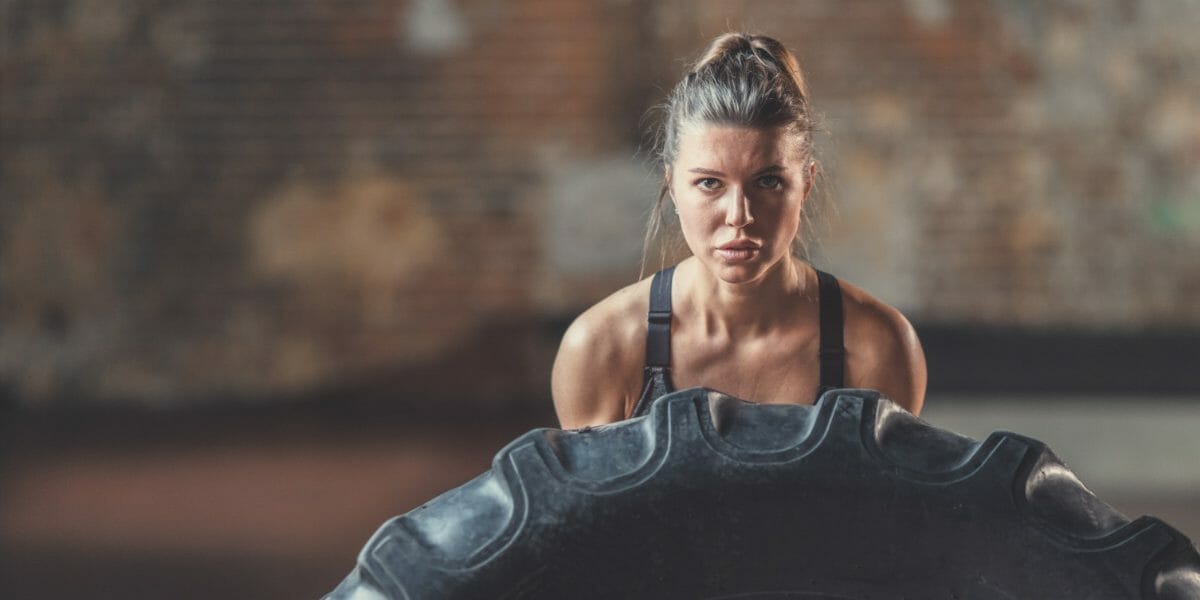 CrossFit Woman pushing tire
