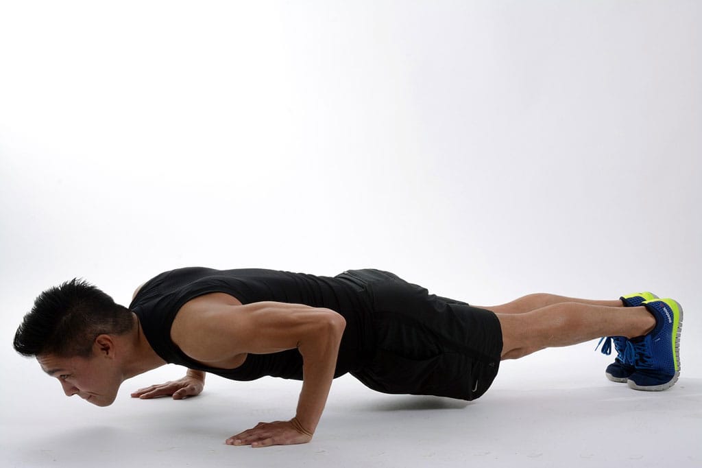 The Bottom of the push up position of the Burpee Exercise