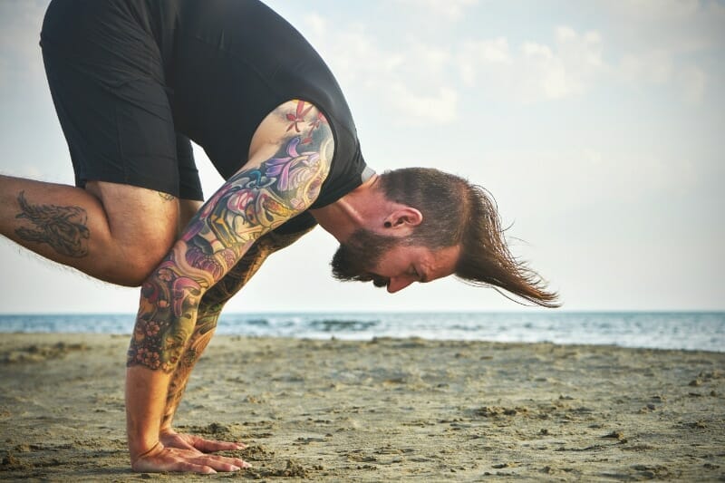 practicing inverted handstand poses and asanas