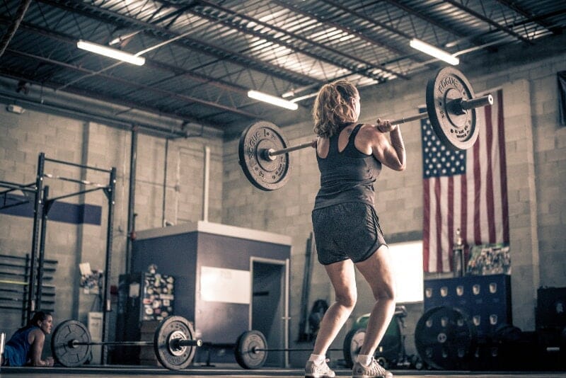 woman performing power clean
