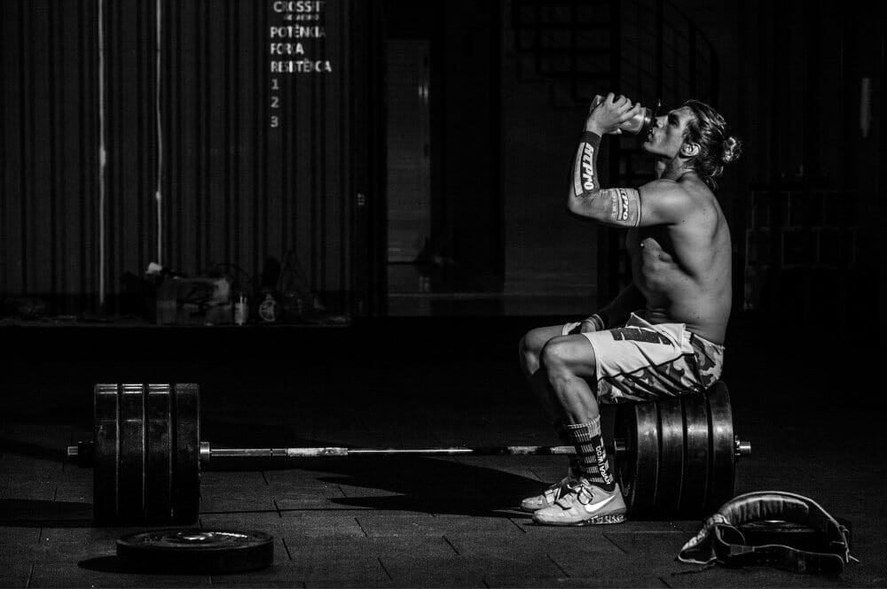 CrossFit athlete consuming supplements post workout