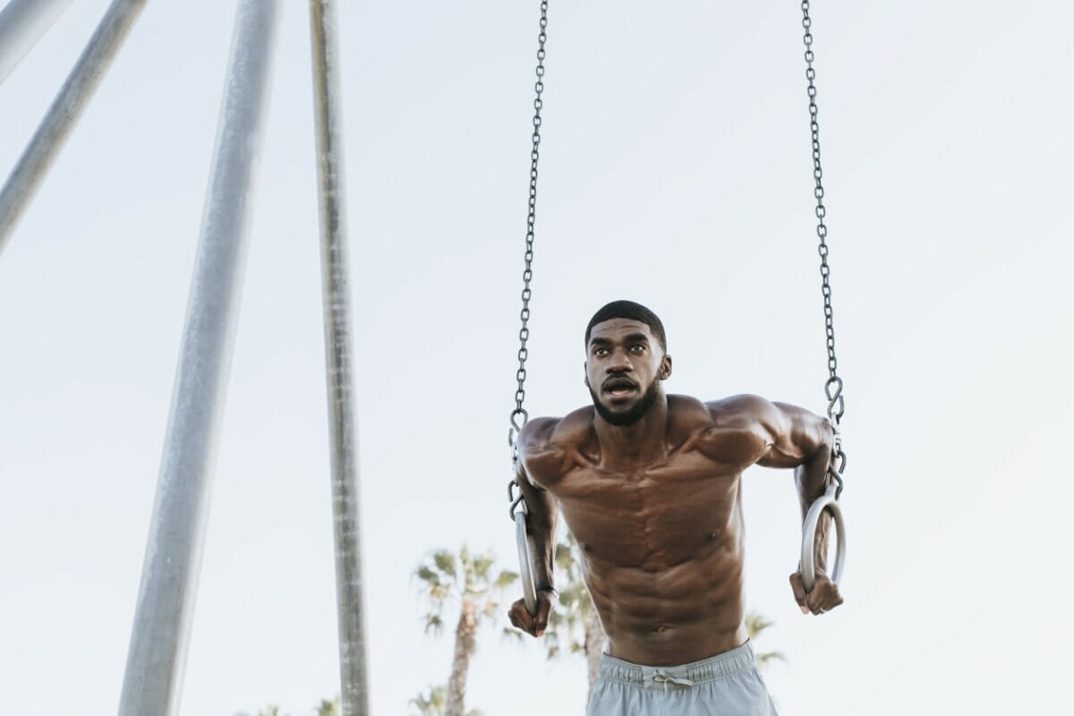 Fit Man Working Out At The Beach