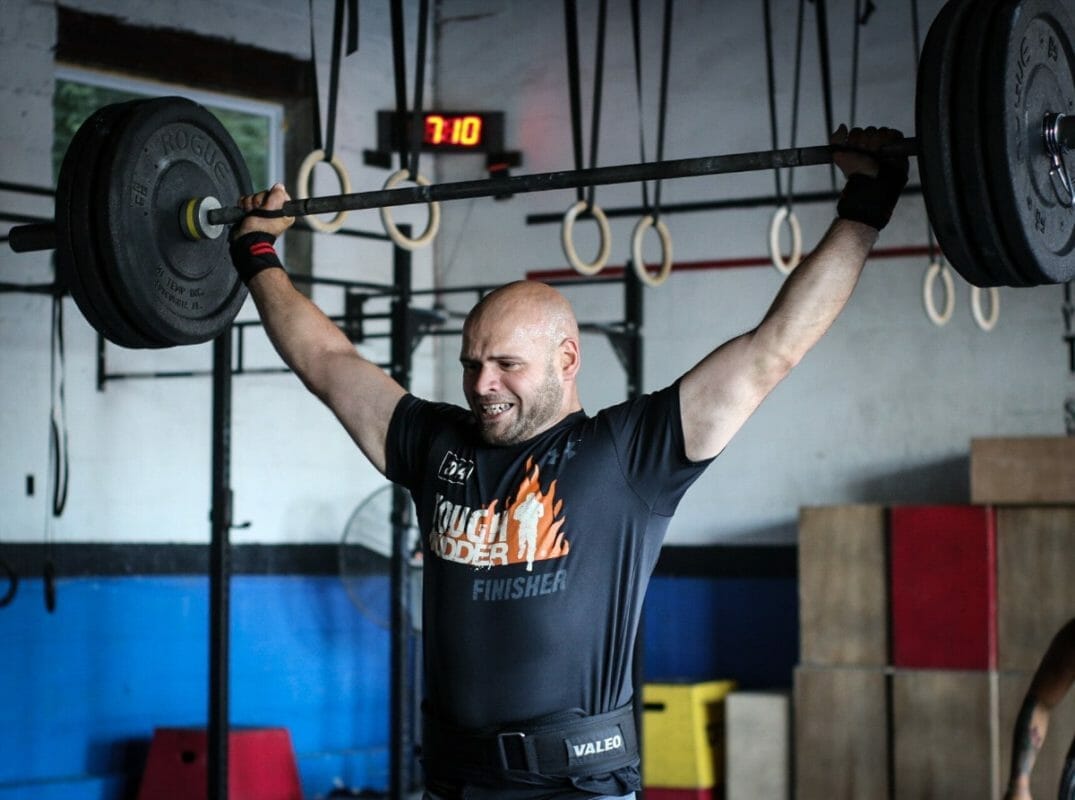Crossfit Athlete Performing Snatch With Wrist Supports
